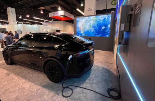 GoodWe/GE’s inverter-integrated charger is plugged into a Tesla